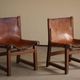 Paco Muñoz, Pair of lounge hunting armchairs, model "Riaza", leather and walnut, 1960