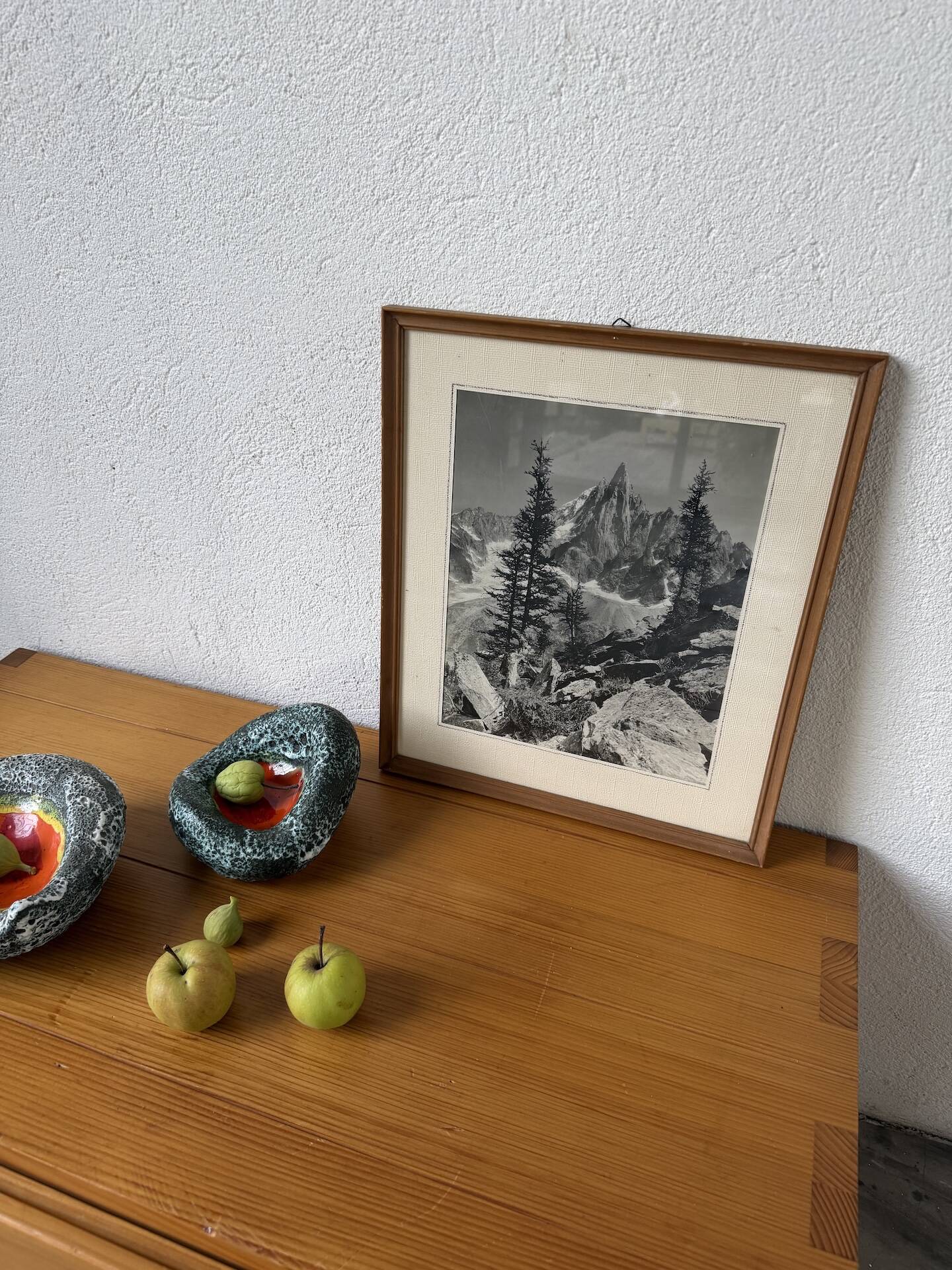 Framed old photo of a mountain landscape.