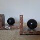 Pair of red marble bookends with black stone spheres – Art Style