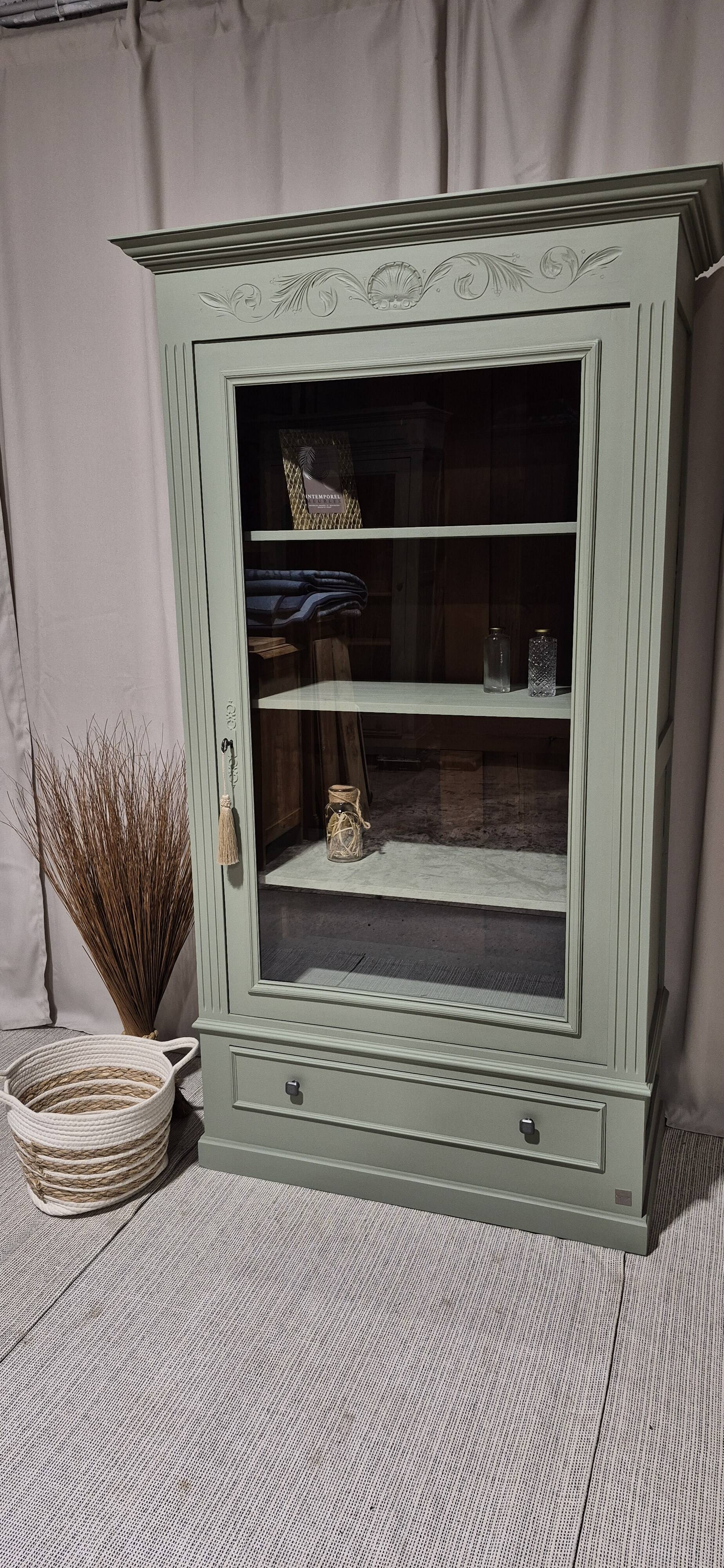Glass display cabinet with drawer