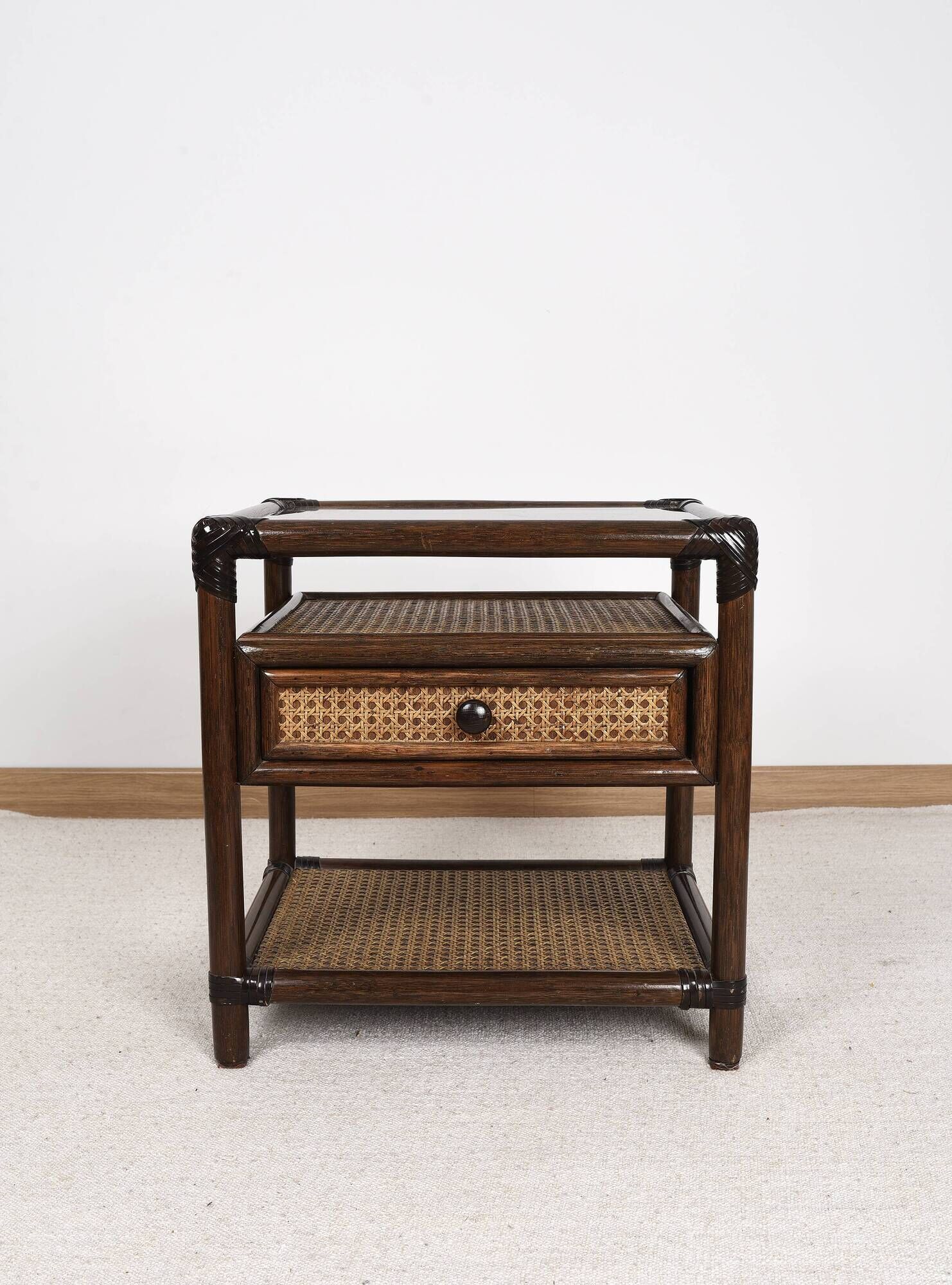 Rattan and cane bedside table, smoked glass top