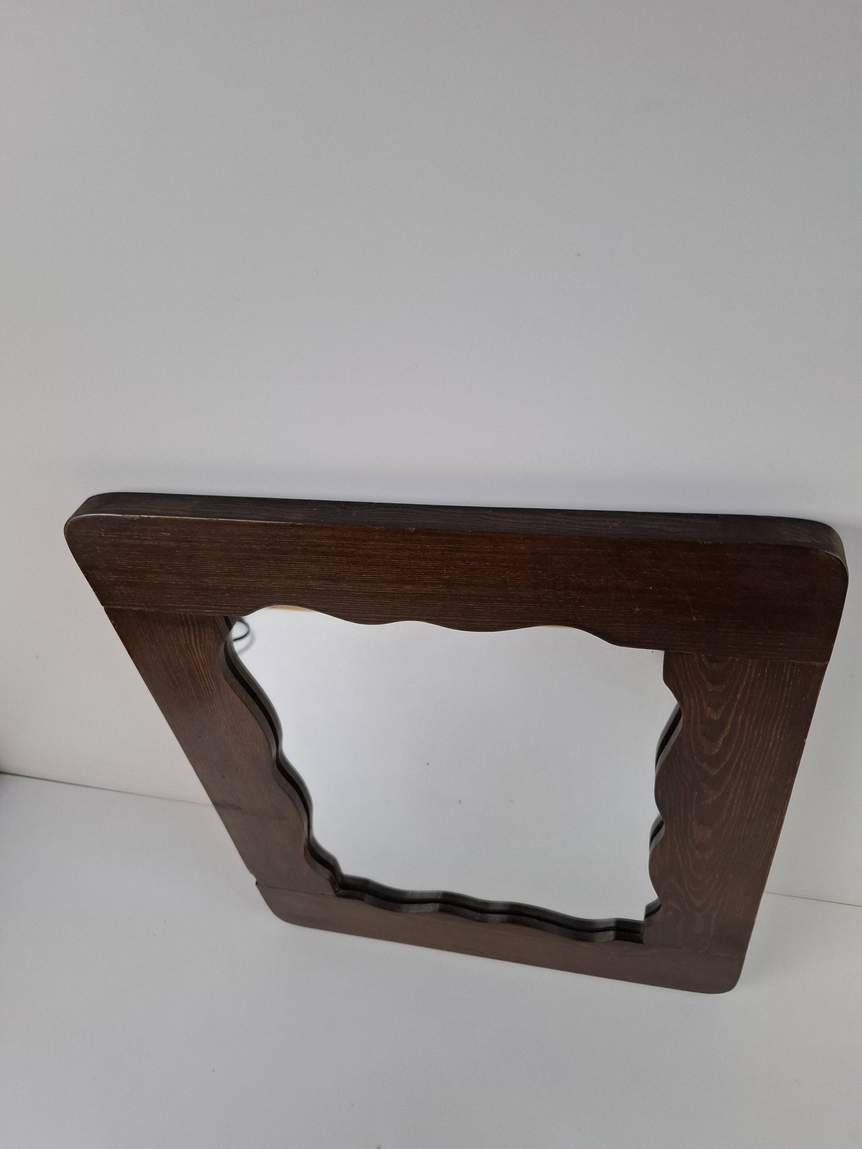 Czechoslovakian wall mirror with a wavy wooden frame, mid-century, 1940s