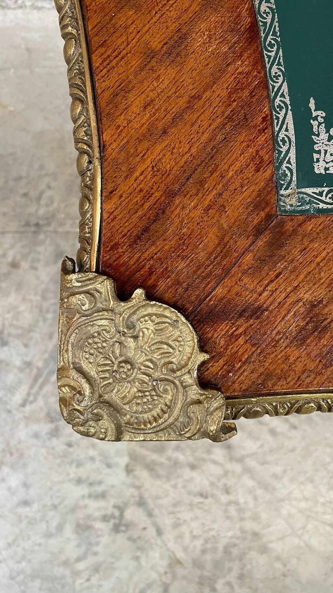 Antique French-style desk with green leather top and bronze mounts