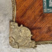 Antique French-style desk with green leather top and bronze mounts