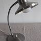 Articulated bedside lamp or wall light in aluminium, France circa 1960.