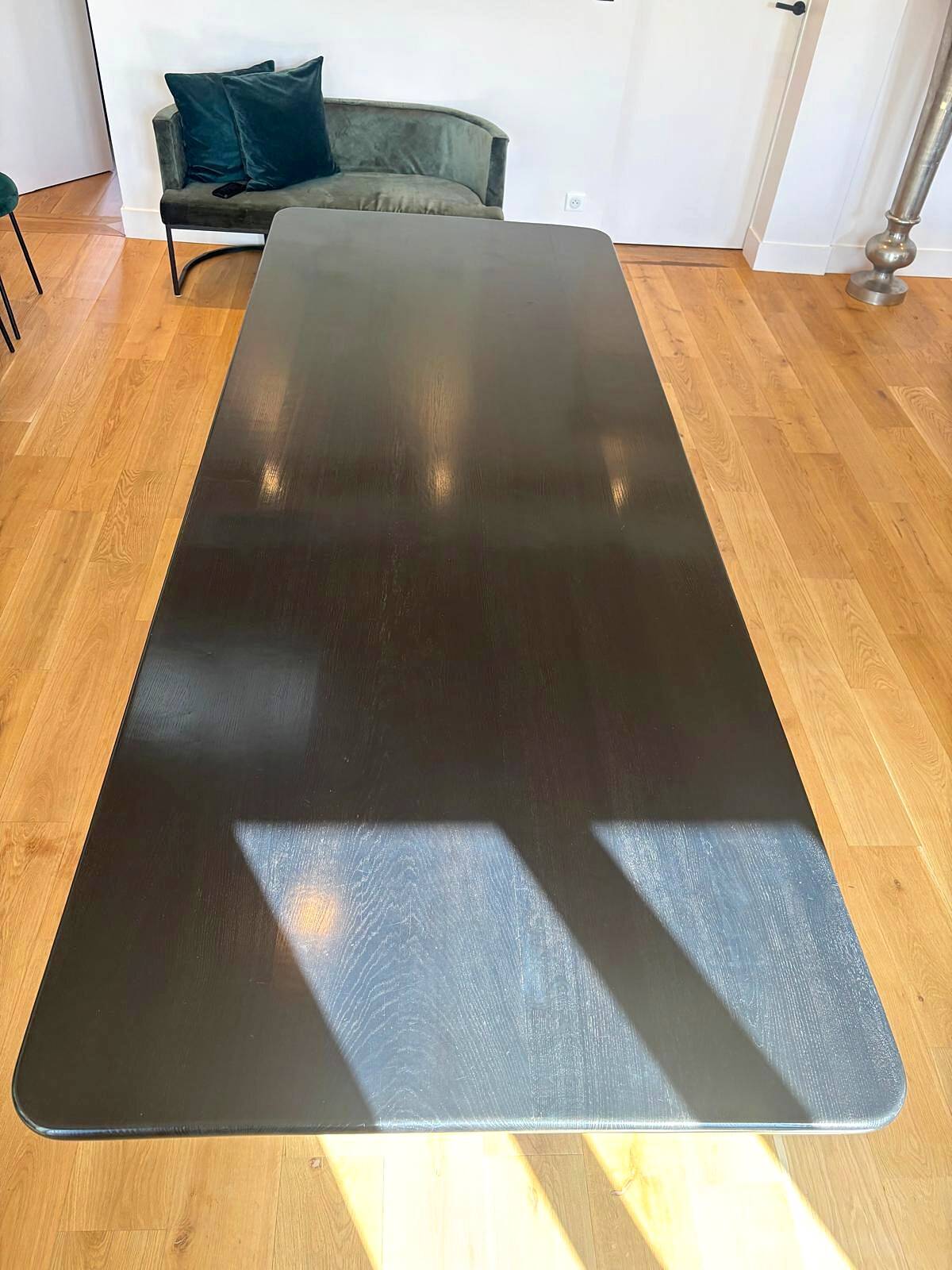 Large dining table in BS Style made of black oak and iron.