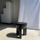 Black mango wood tripod side table with a semi-spherical top, height: 45 cm, diameter: 44 cm.