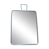 Simple rectangular barber mirror with a stand.