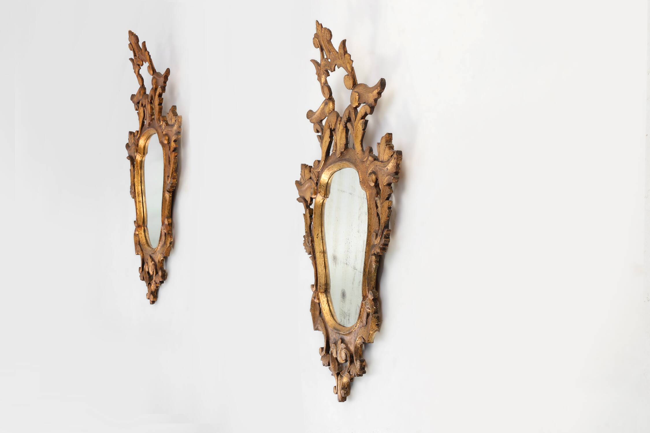 Pair of two Venetian Rococo giltwood mirrors, ca. 1850 Italy