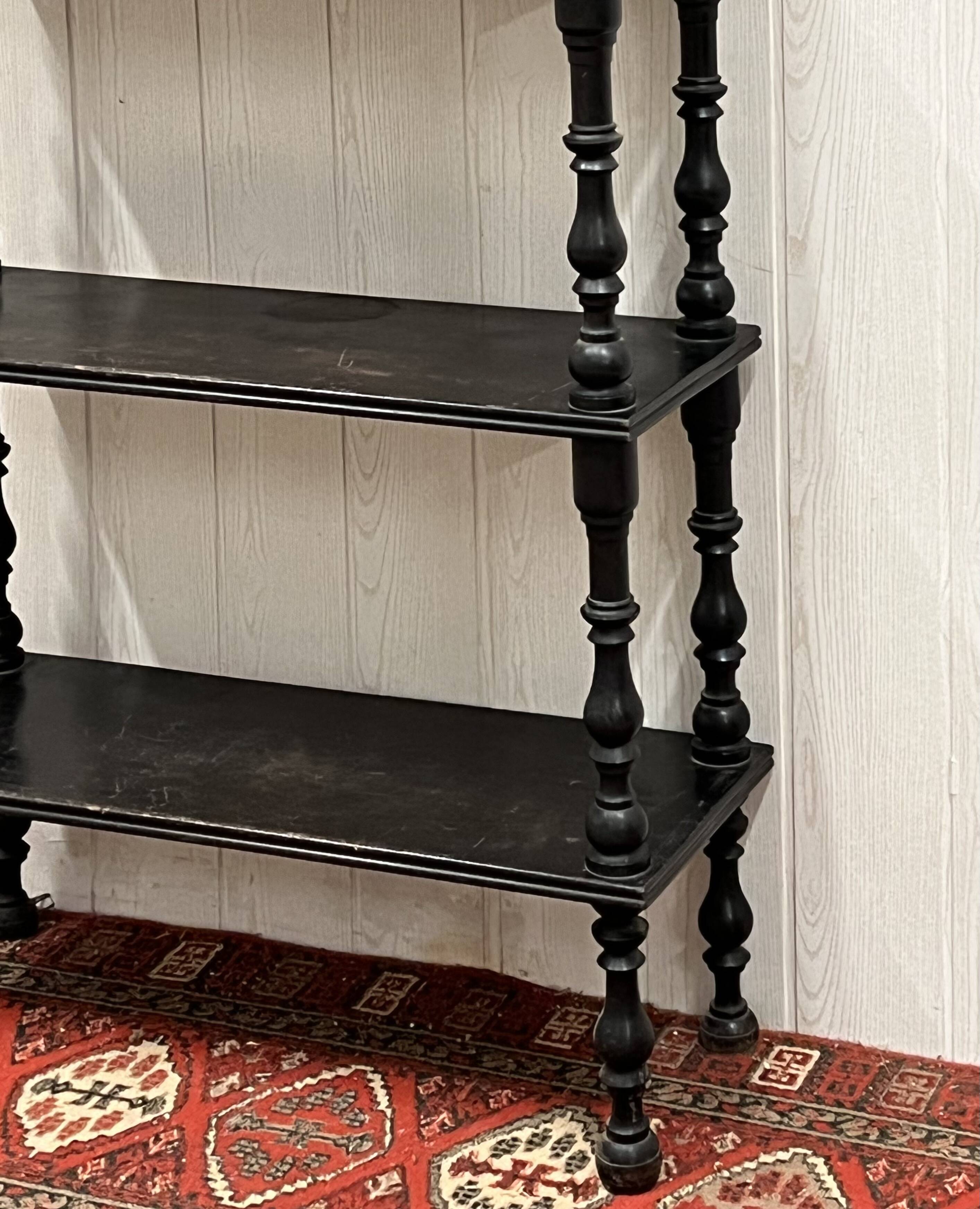 Blackened wooden shelf.