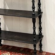 Blackened wooden shelf.