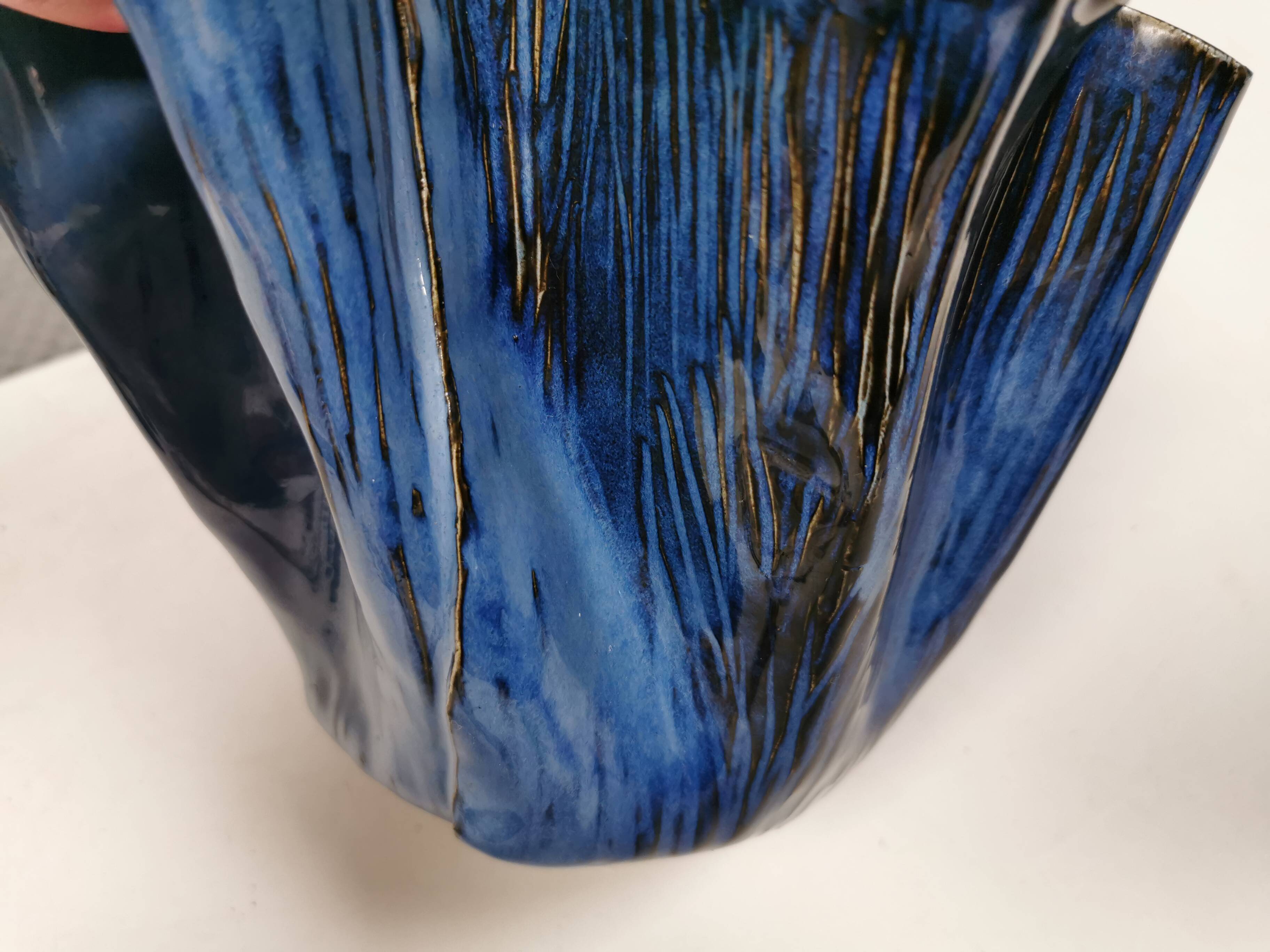 Very special vase in “folded” bluish glazed clay.