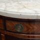Louis XVI style chest of drawers with marquetry and marble top.