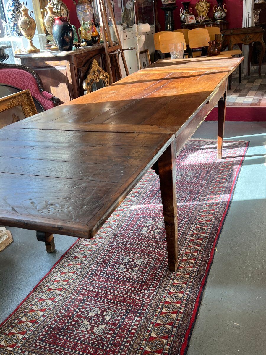 Rustic solid wood table: Elegance and functionality for your family meals, 19th century.