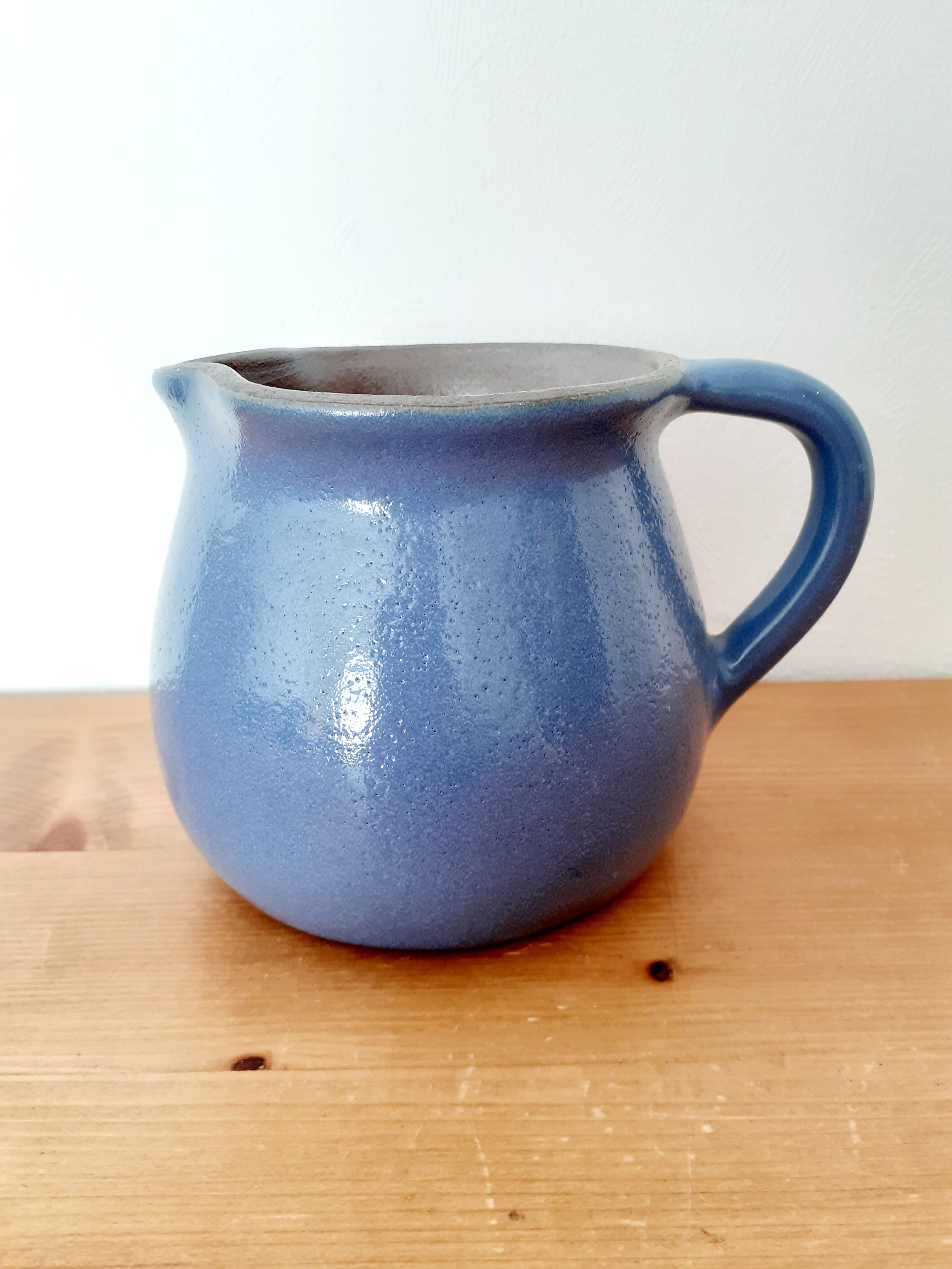 Old glazed blue sandstone pitcher