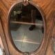 Curved mahogany display cabinet from the Napoleon III period. It has two doors and two shelves.