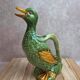 Large vintage duck jug in barbotine – green glazed earthenware – 29 cm