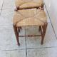 Pair of vintage wooden and straw stools from the 1950s, rectangular.