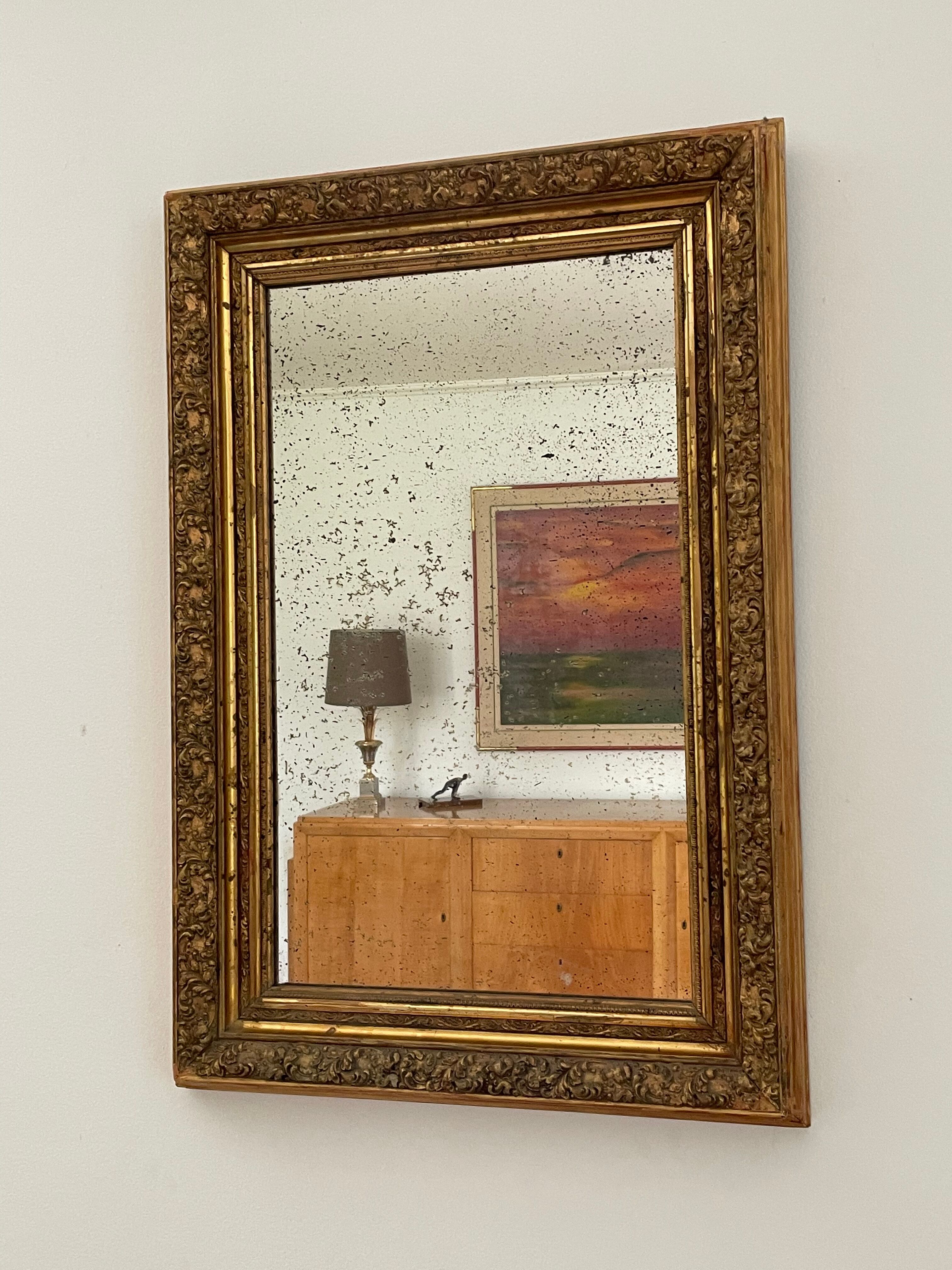 Antique mirror in gilded wood