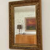 Antique mirror in gilded wood