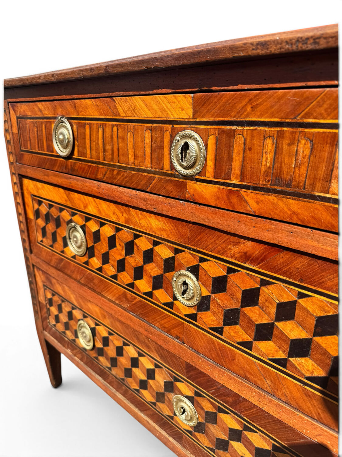 Louis XVI commode with marquetry featuring a design of precious wood cubes, 18th century.