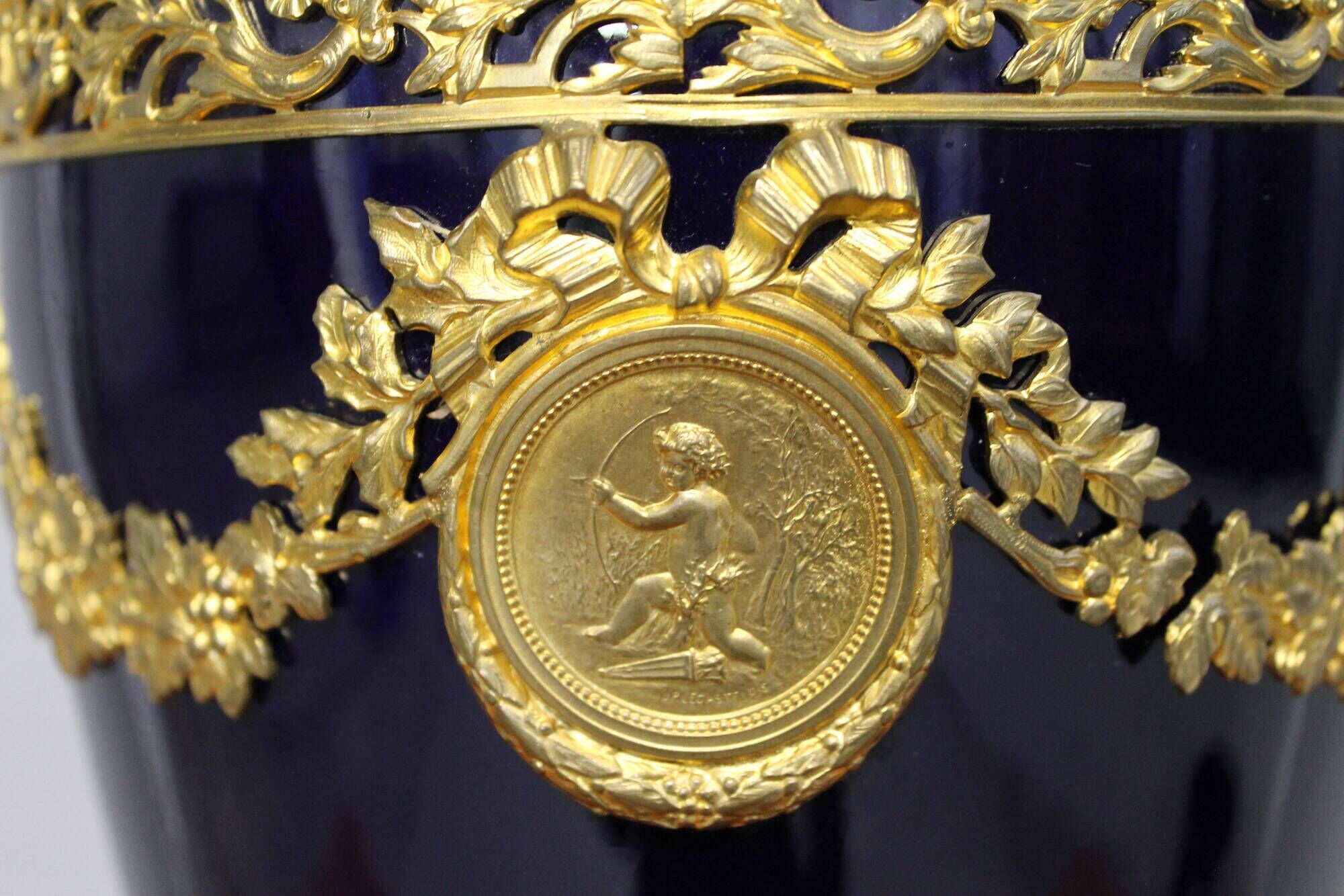 Vase signed Legastelois in blue ceramic of Sèvres and gilded bronze