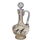 Large Art Nouveau carafe with iridescent enamelled glass and flowers.
