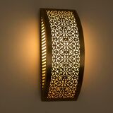 Moroccan brass wall light with intricate floral decoration