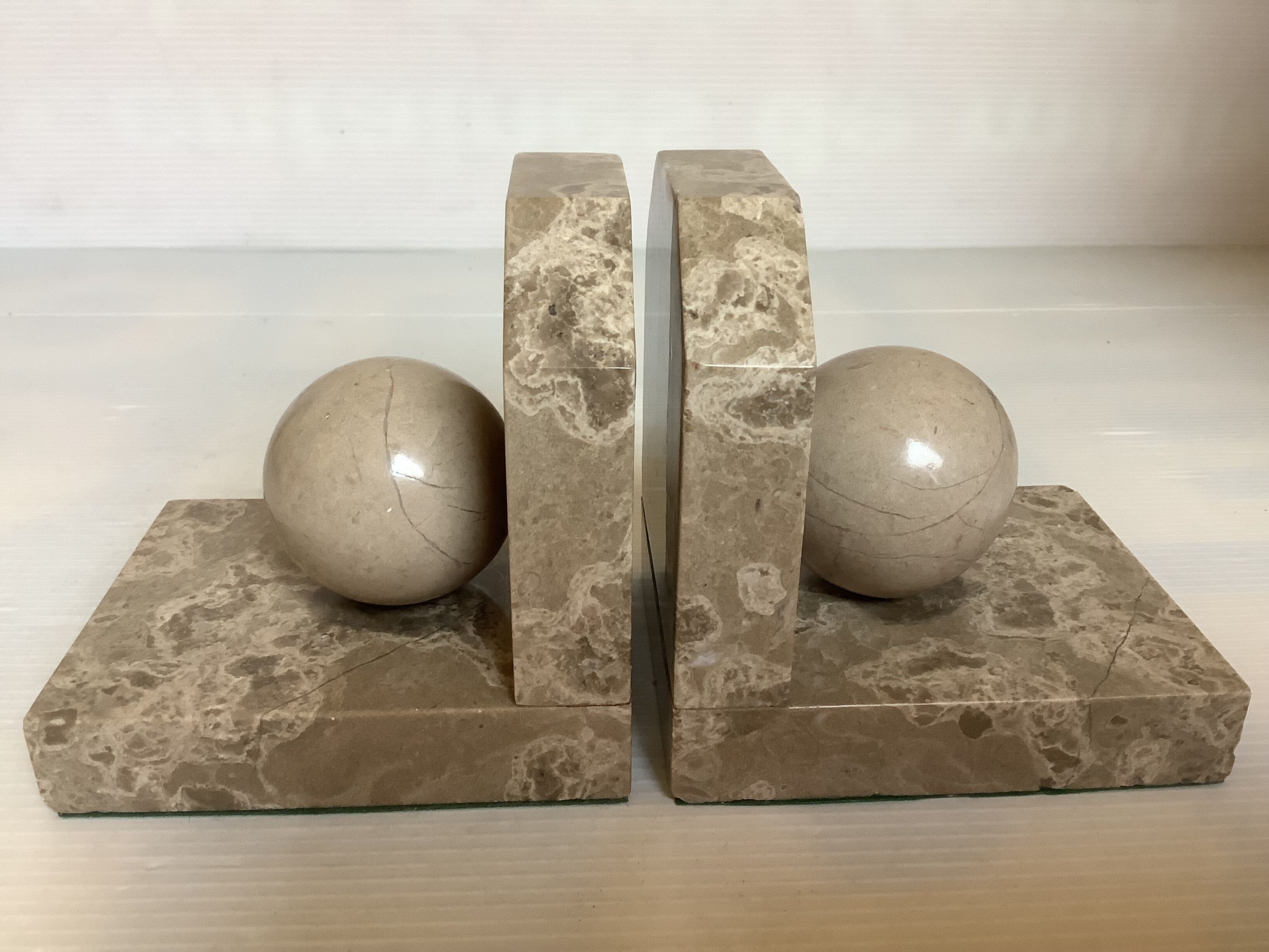 Pair of beige marble bookends.