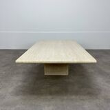 Rectangular travertine coffee table with central leg