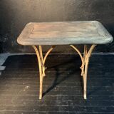 Ancient wrought iron and wood garden table