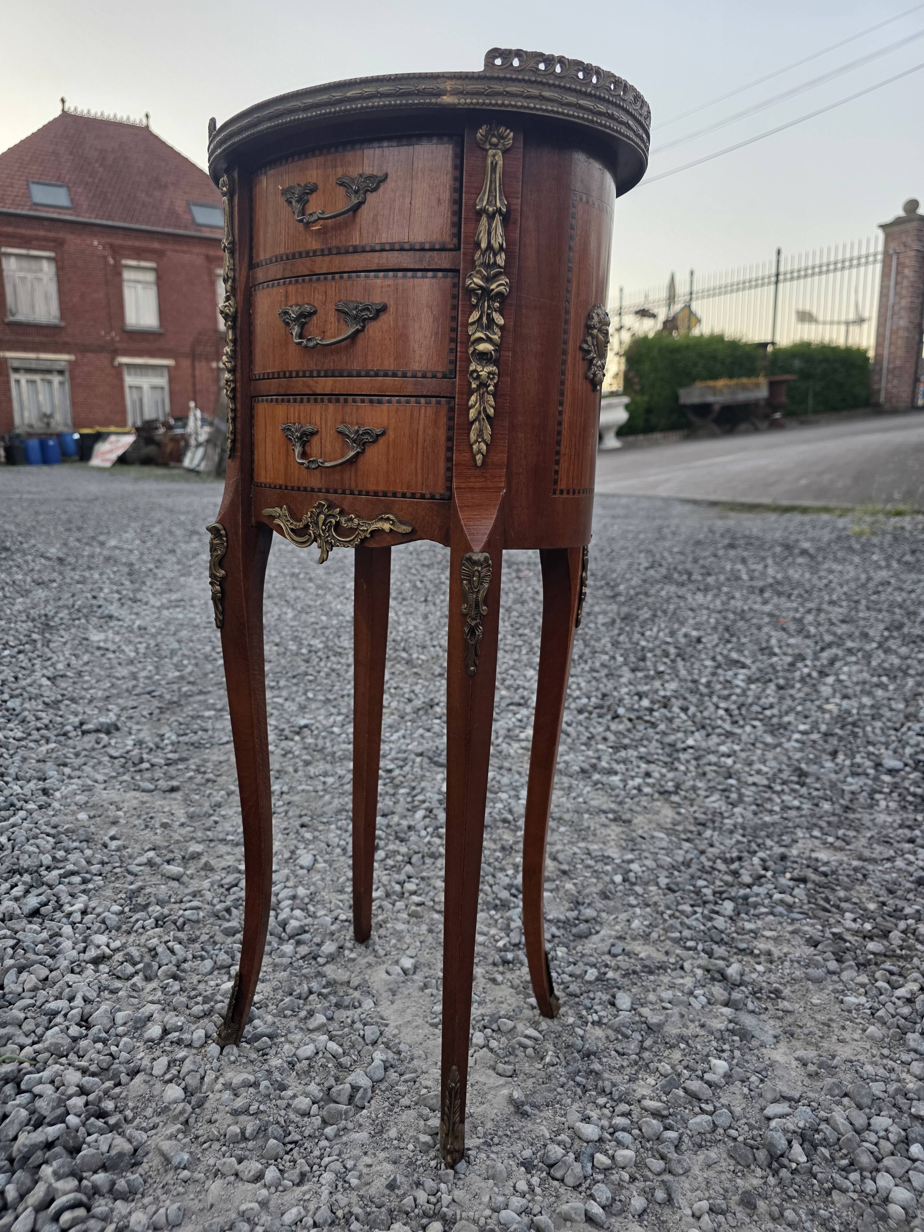 Oval bedside table in Louis XV style with marquetry.
