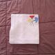 Vintage square linen tablecloth hand-embroidered with floral patterns — 1950s/60s