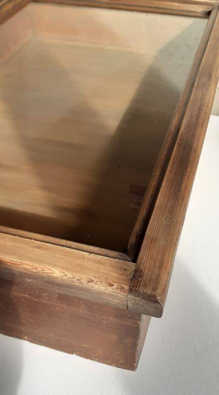 Old sloping pine display case