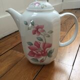 Vintage porcelain coffee or teapot with milk jug