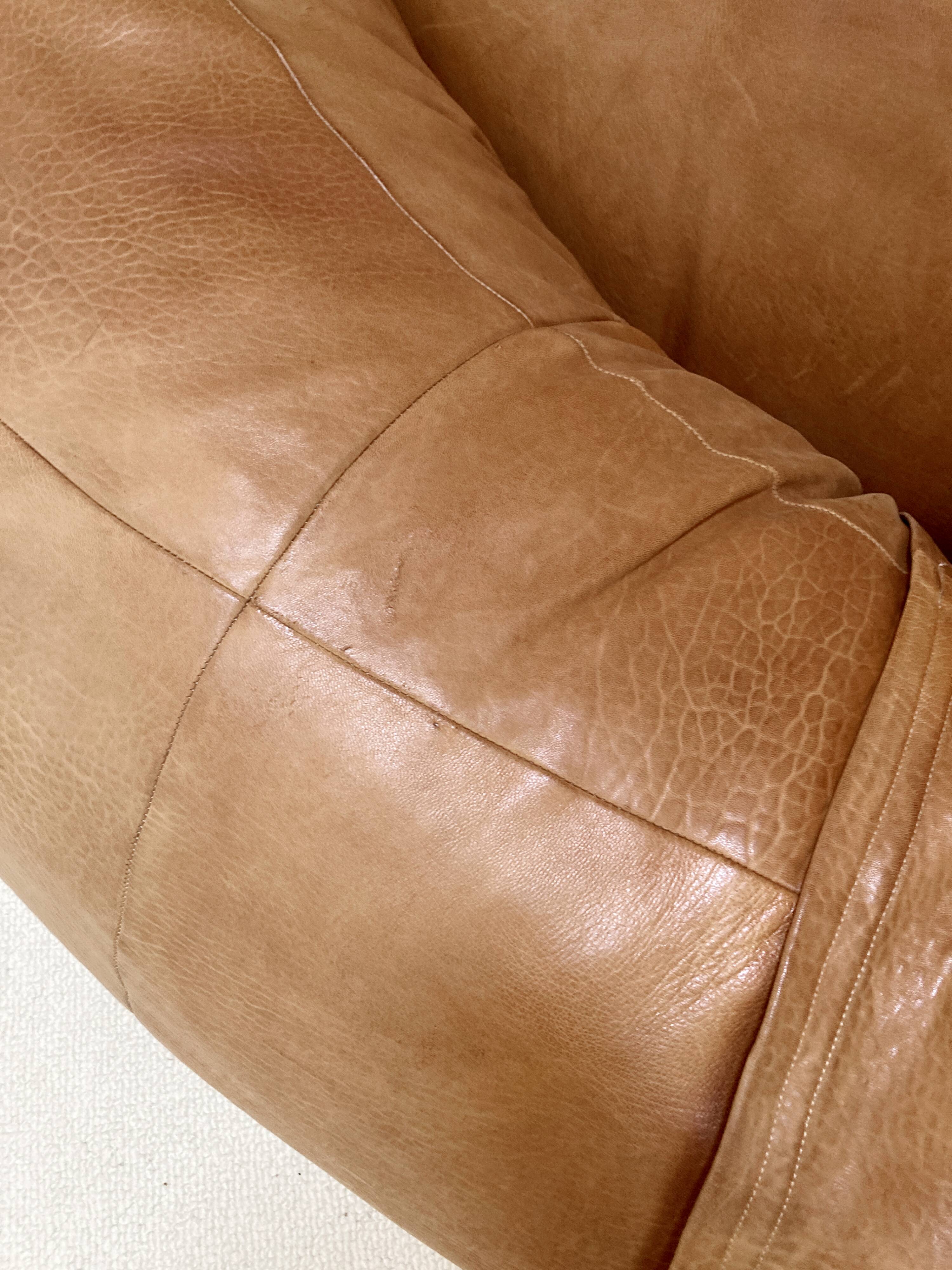 Two-seater leather pouf sofa by Raphaël Raffel for Honoré Paris