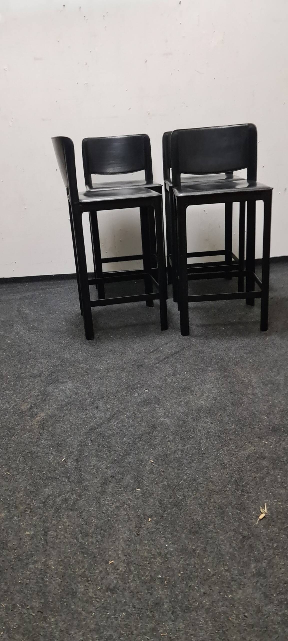 A set of four Italian leather bar stools by Matteo Grassi