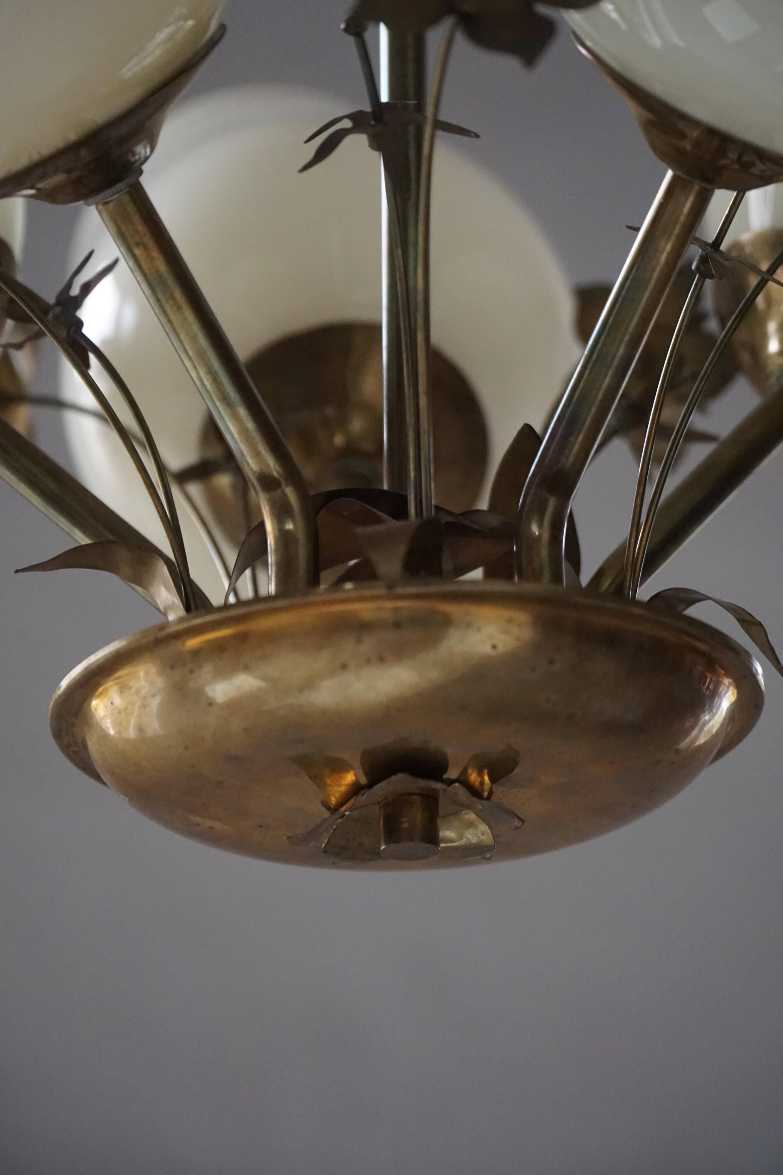 Five-branch brass and glass chandelier by Paavo Tynell for Idman OY Finland, 1940s.