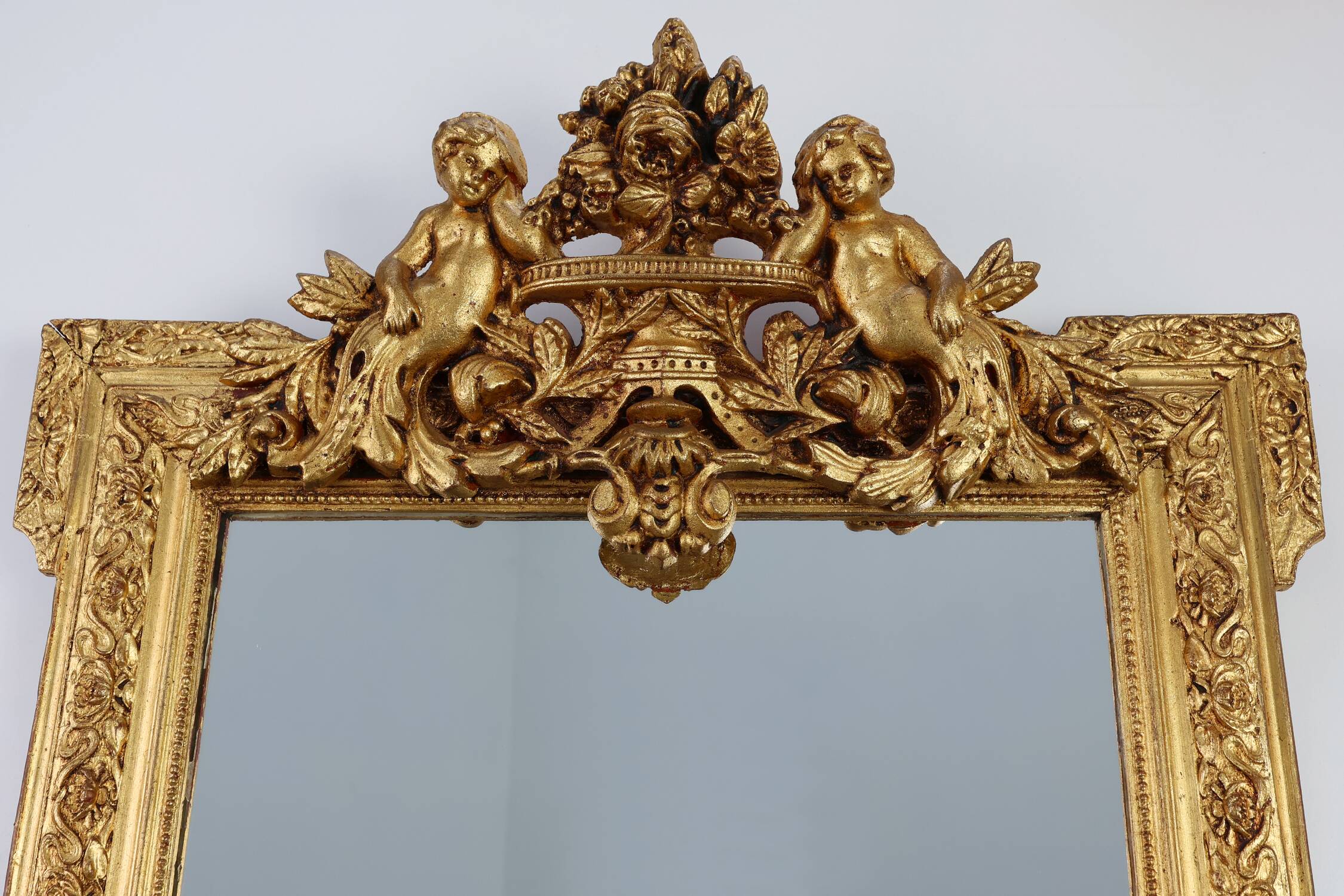 French rococo style richly sculpted gilted oak mirror, 19th century