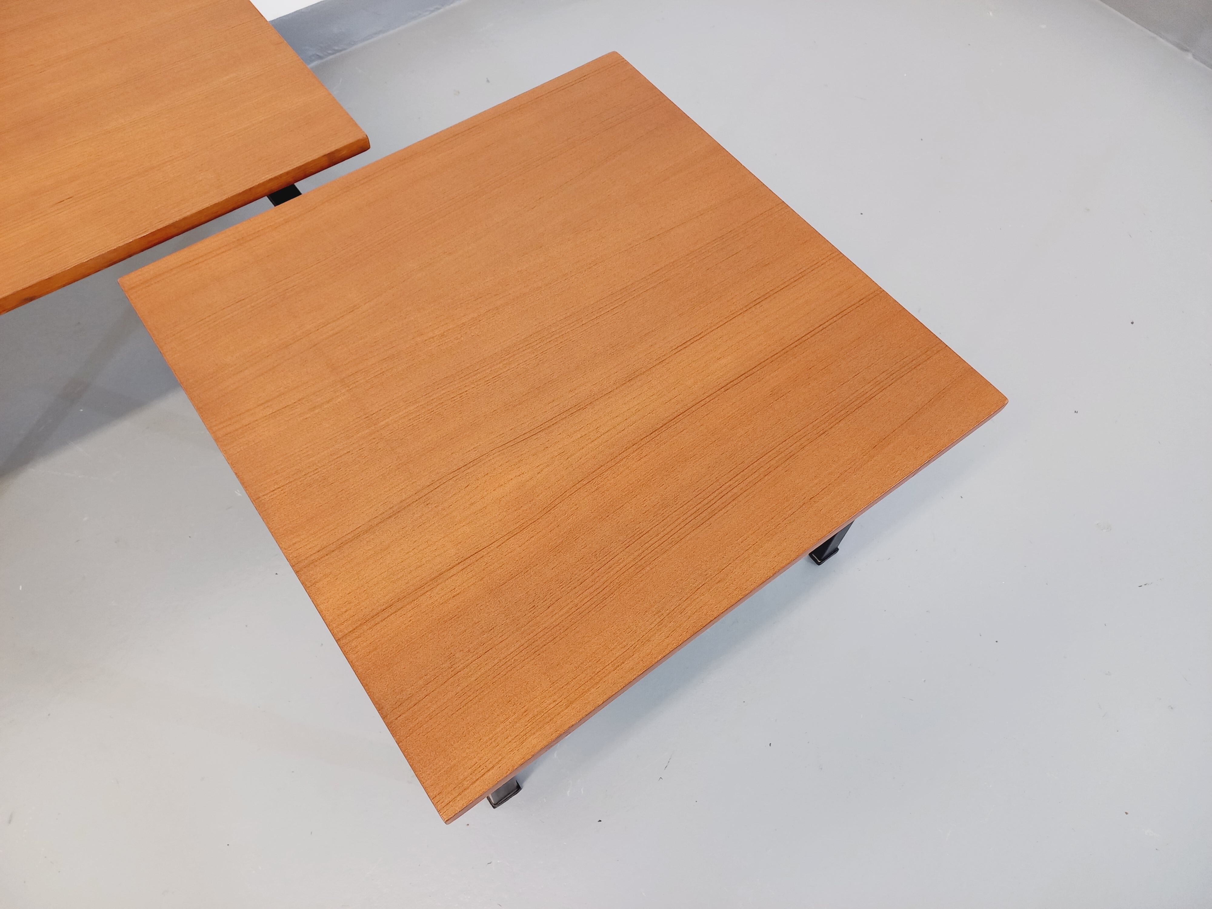 Suite of two vintage modernist Isa coffee tables in teak and black metal from the 60s