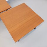 Suite of two vintage modernist Isa coffee tables in teak and black metal from the 60s