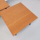 Suite of two vintage modernist Isa coffee tables in teak and black metal from the 60s