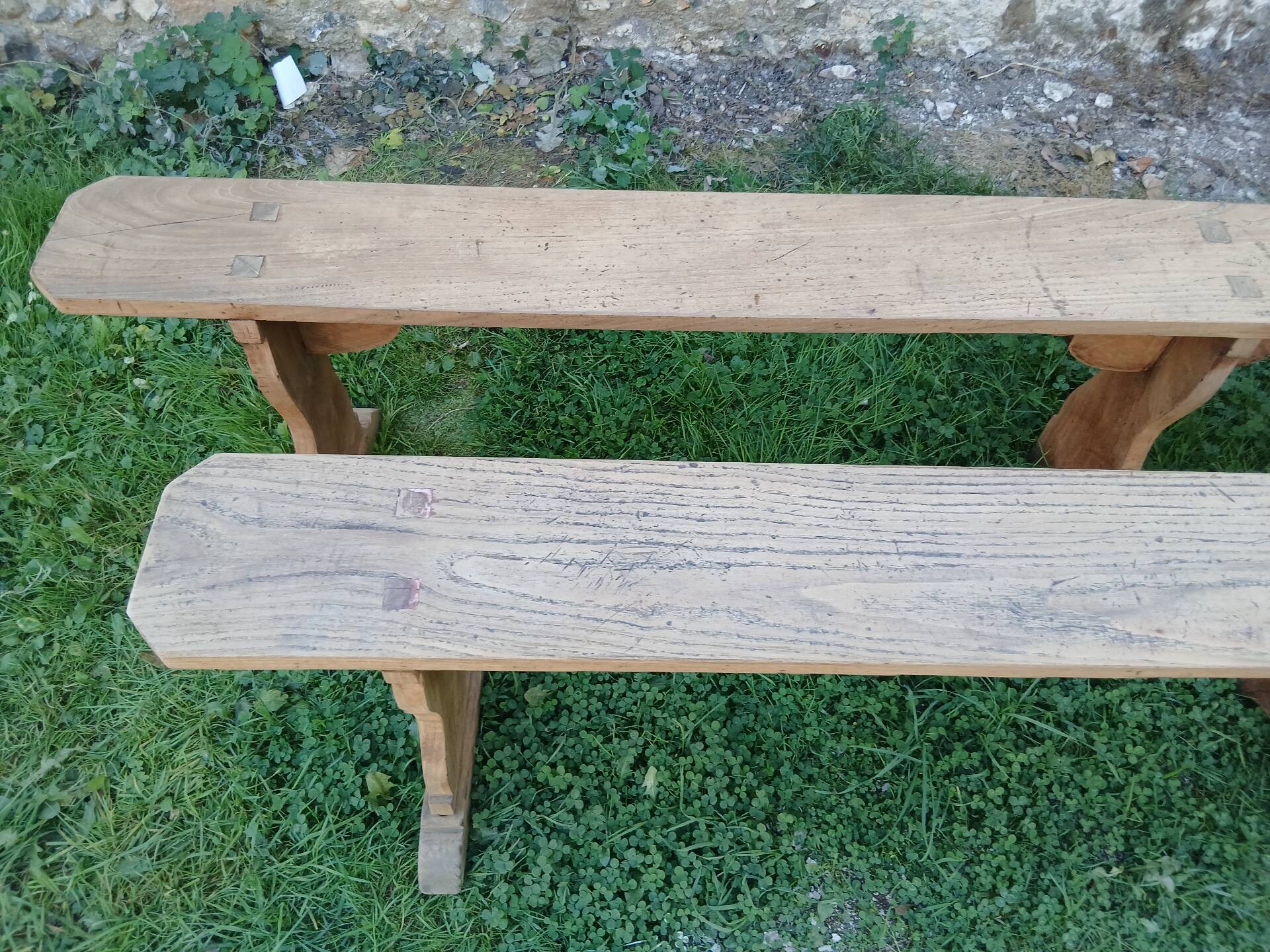Pairs of large benches in raw fir wood.