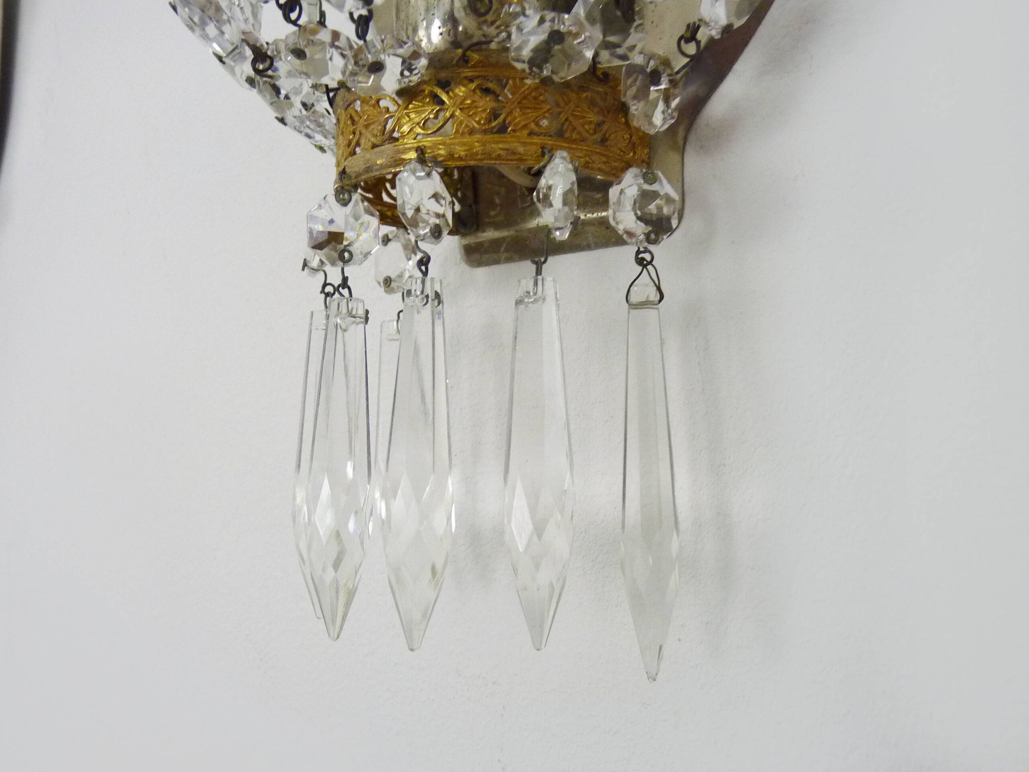 Pair of vintage bronze basket wall lights with glass pendants. The 50's
