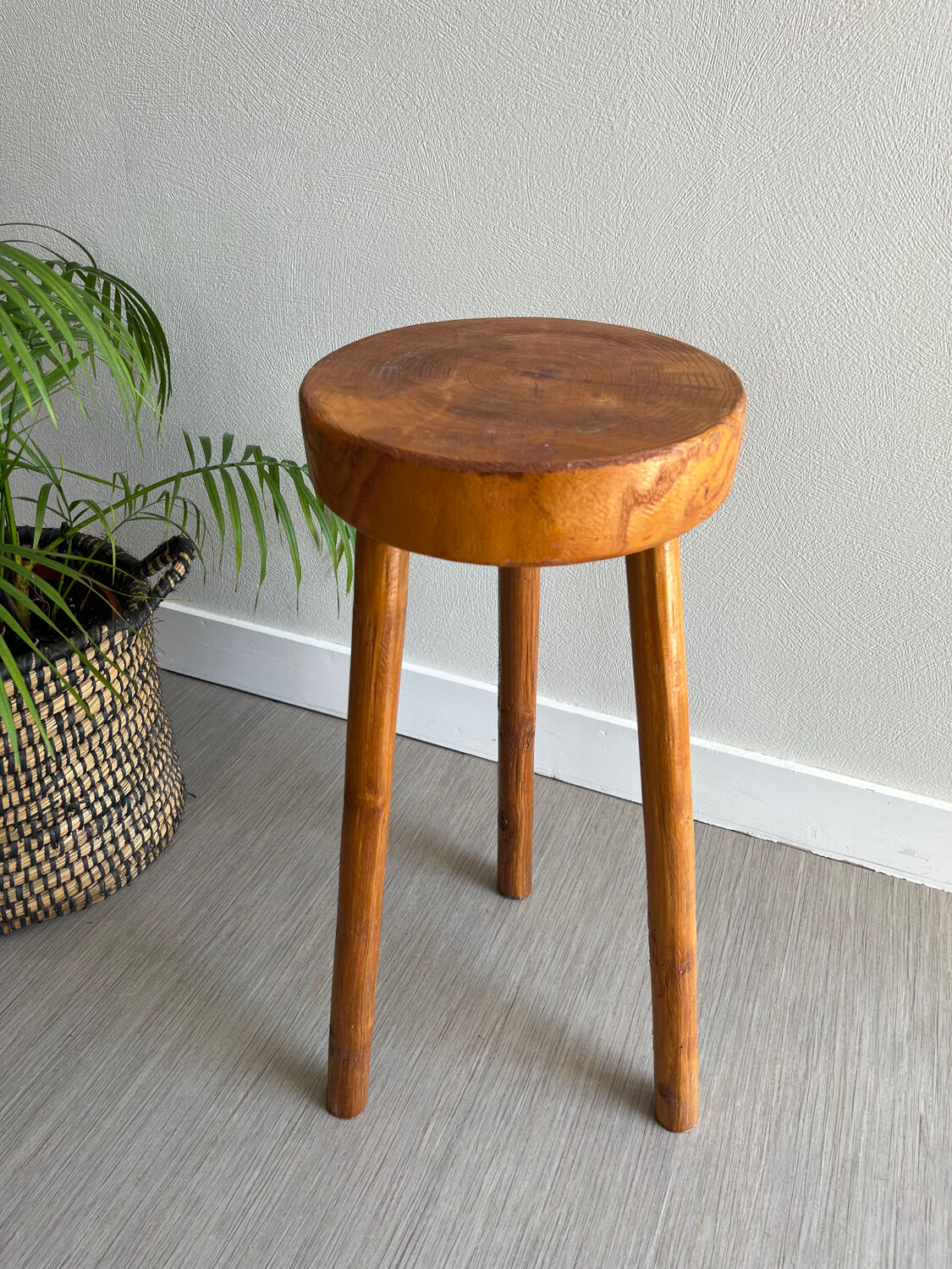Tripod stool in a brutalist style