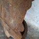 Old cast iron wall fountain with lion's head
