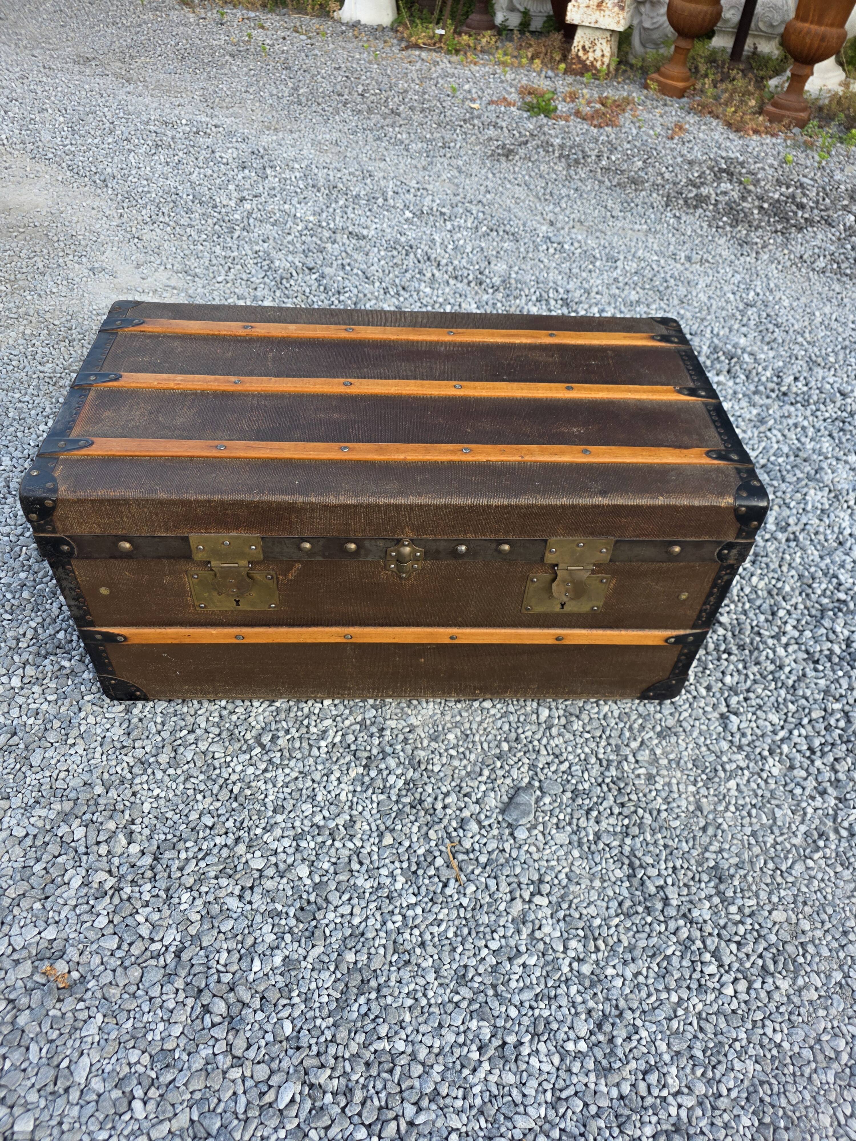 Old travel trunk in oilcloth