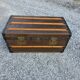 Old travel trunk in oilcloth