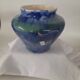 a blue flamed stoneware vase