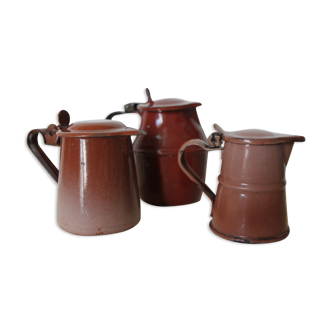 Trio of enamelled milk jars